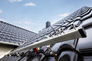 Rail for solar panel mounting system on a tiled roof