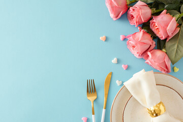 Mother's Day celebration concept. Top view photo of plate with cutlery knife fork fabric napkin with ring bunch of pink roses and small hearts on isolated pastel blue background with empty space