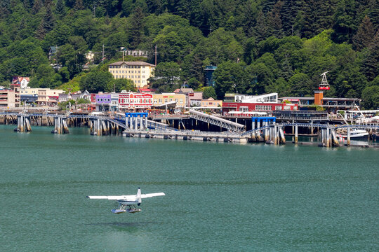 Seaplane landing in Juneau Alaska harbor landscape