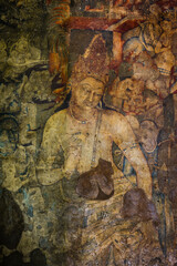 Fototapeta na wymiar The 5th-century Bodhisattva Padmapani painting depicting the Buddha holding a lotus flower at Ajanta caves, Maharashtra, India.