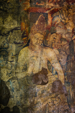 The 5th-century Bodhisattva Padmapani painting depicting the Buddha holding a lotus flower at Ajanta caves, Maharashtra, India.