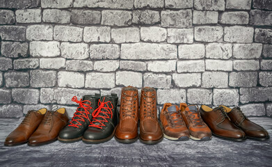 Leather men's shoes on brick wall background