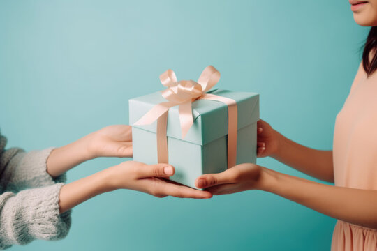 A gift exchange between a couple, friends or famaly, with hands holding wrapped presents against a blue background ai generative