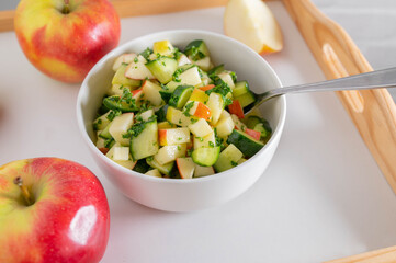 Cucumber apple salad in a bowl