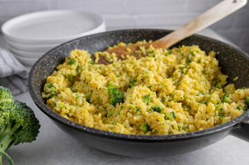 Healthy gluten free side dish with brown rice. Cooked with broth, curry powder and broccoli sprouts.