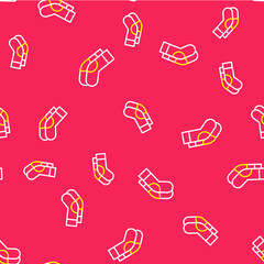 Line Socks icon isolated seamless pattern on red background. Vector