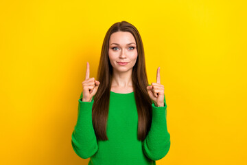 Portrait of pretty young person indicate fingers up empty space offer isolated on yellow color background