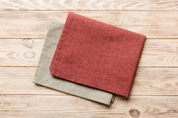 top view with red empty kitchen napkin isolated on table background. Folded cloth for mockup with copy space, Flat lay. Minimal style