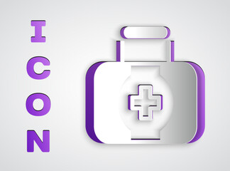 Paper cut First aid kit icon isolated on grey background. Medical box with cross. Medical equipment for emergency. Healthcare concept. Paper art style. Vector