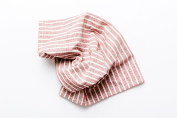 top view with red empty kitchen napkin isolated on table background. Folded cloth for mockup with copy space, Flat lay. Minimal style