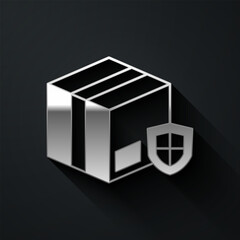 Silver Delivery security with shield icon isolated on black background. Delivery insurance. Insured cardboard boxes beyond the shield. Long shadow style. Vector