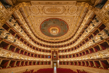 Parma, Italy - April 10, 2023: panoramic view of the historic Teatro Regio, formerly known as New Ducal Theatre, in Emilia-Romagna, Italy.
StructuStructure is built in wood and was completed in 1618. - 591945083