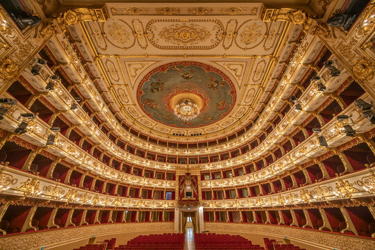 Parma, Italy - April 10, 2023: panoramic view of the historic Teatro Regio, formerly known as New Ducal Theatre, in Emilia-Romagna, Italy. 
StructuStructure is built in wood and was completed in 1618.