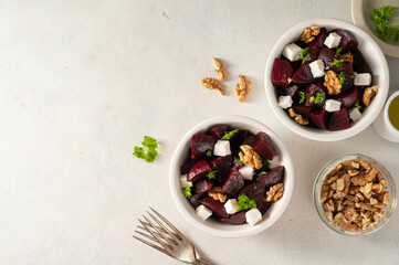 Beetroot salad with feta cheese and walnuts, top view, copy space