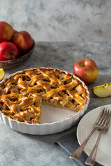 Whole apple pie, homemade fresh fruit pie with red apples. Copy space.