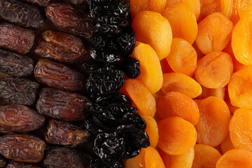 dried apricots, dates and prunes. Texture of dried fruits. Top view.