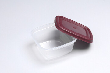 Plastic container for storing food on a gray background