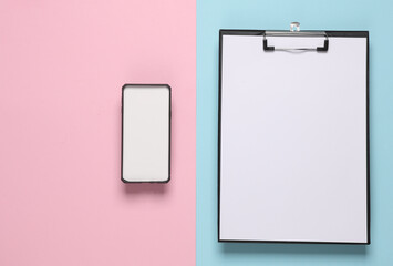 Smartphone With white screen, clipboard on blue pink background. Template for design