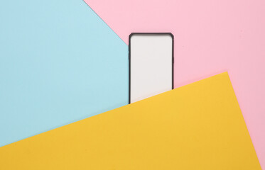 Black silicone case for a smartphone with a white tab on colored background