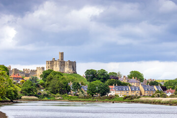 Fototapeta na wymiar View across the river Coquet to the medieval Warkworth Castle and the village of Warkworth in Northumberland.