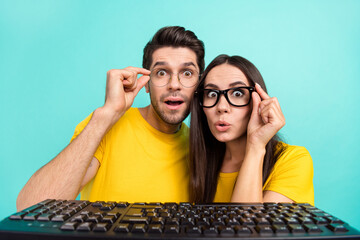 Photo of young excited impressed reaction people hold eyeglasses pouted lips browsing keyboard...