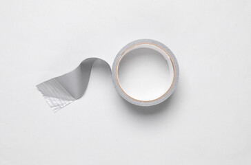 Roll of metallic duct tape on white background