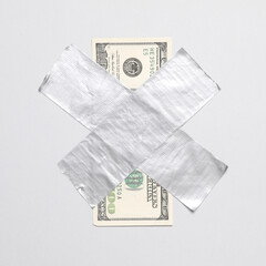 100 dollar bill fixed with adhesive tape on white background. Conceptual pop, contemporary art, business concept