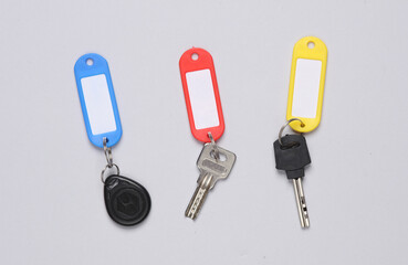 Plastic tags with different keys on gray background