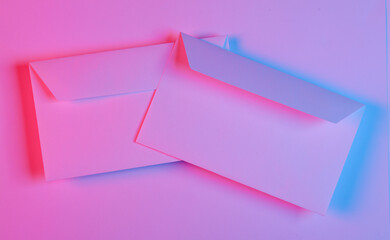 Paper envelopes in red blue neon light