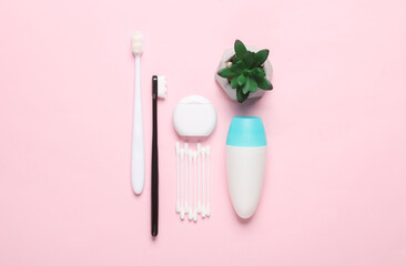 Objects for personal hygiene on a pink background. Flat lay