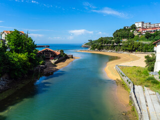 confluence of the River Rio Lea into the Atlantic Ocean In Lekeitio. The mouth of the river Lea Basque Country, Spain