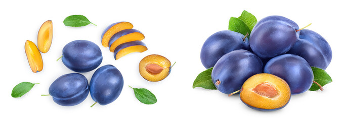fresh blue plum and half with leaves isolated on white background. Top view. Flat lay