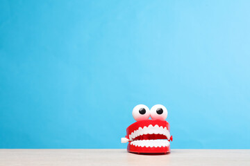 Joke jaw on table, blue background