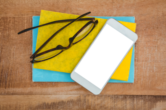 Close up view of smartphone and glasses