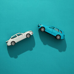 Toy cars model against blue background. Top view