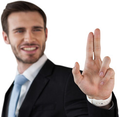 Happy businessman touching invisible screen