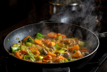 Cooking vegan vegetable stew. Rice with different vegetables - leek, mushrooms, potatoes seasoned with curry seasoning.