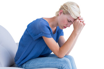 Depressed woman sitting on couch