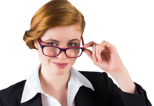 Redhead businesswoman touching her glasses