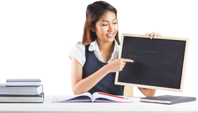 Smiling businesswoman pointing a blackboard - Powered by Adobe