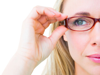 Close up of pretty blonde with red reading glasses