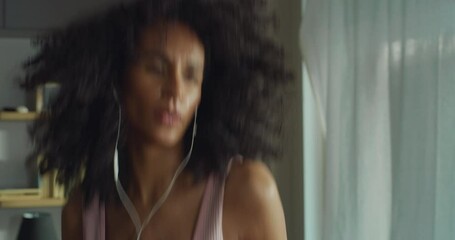 Portrait of Strong Southeast Asian Fitness Girl in Workout Clothes Using Dumbells, Practicing Boxing at Home. Female Fitness Enthusiast Training, Working on her Stamina and Health, Staying in Shape