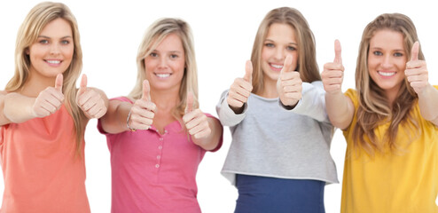 Obraz premium Four smiling girls giving the thumbs up