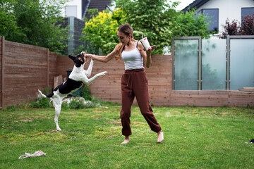 Woman playing with a dog