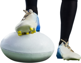 Rugby player posing feet on the ball