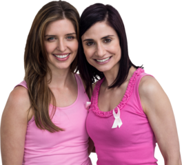 Smiling women in pink outfits posing for breast cancer awareness