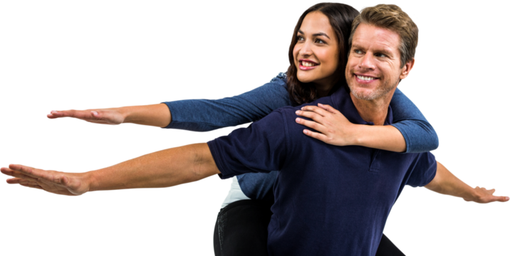Cheerful couple with arms outstretched