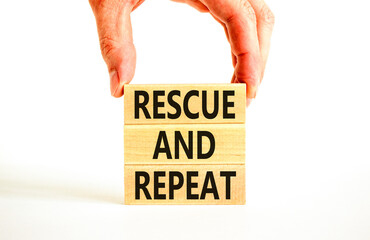 Rescue and repeat symbol. Concept words Rescue and repeat on wooden block on a beautiful white...