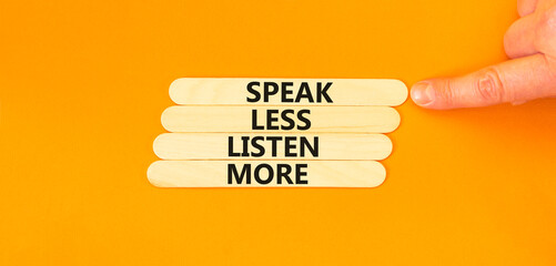 Speak less listen more symbol. Concept words Speak less listen more on wooden stick. Beautiful orange table orange background. Motivational business speak less listen more concept. Copy space.