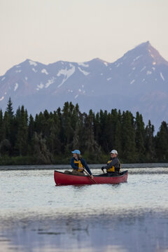 A Couple Canoeing On Stone Step Lake; Homer, Alaska, United States Of America